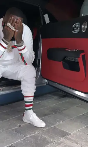 Rick Ross wearing Gucci pants