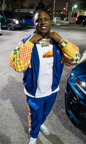 Tay Keith wearing Stussy t-shirt