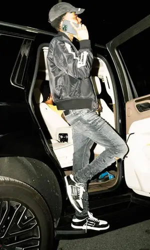 Lil Poppa wearing Amiri jacket
