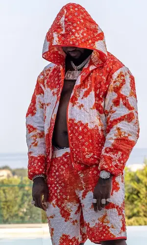 Headie One wearing Louis Vuitton jacket