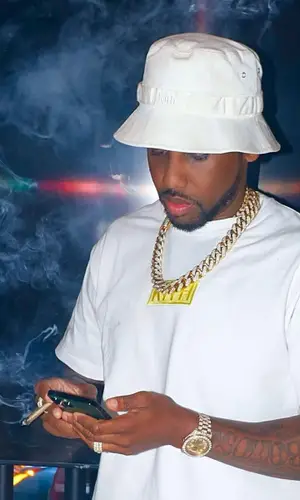 Fabolous wearing Supreme backpack