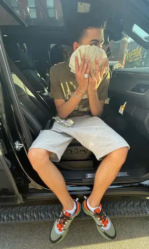 Jay Critch wearing Dior shorts