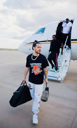 Russ wearing Bottega Veneta bag