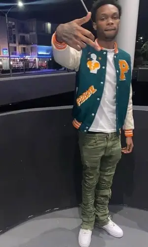 Lil Eazzyy wearing Screwface jacket