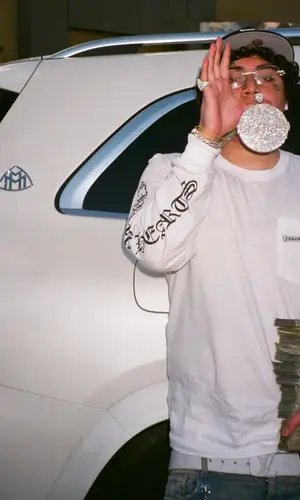 OhGeesy wearing Louis Vuitton belt