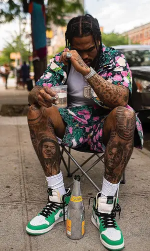 Dave East’s Outfit in Nike Sneakers, Supreme Hat & The North Face (2022)