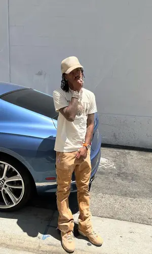Rich The Kid wearing Gallery Dept. pants