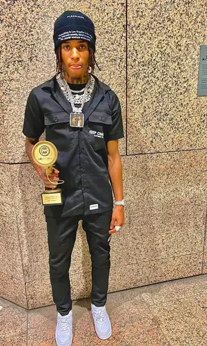 NLE Choppa wearing Pleasures hat