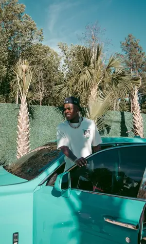 DaBaby wearing Amiri jeans