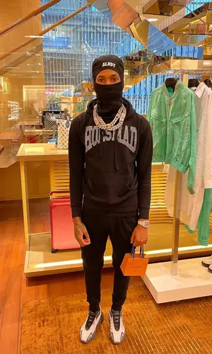 NLE Choppa’s Outfit in Champion Pants, Adidas Sneakers & Alrdy (2022)