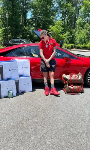 Young M.A’s Outfit in Alexander McQueen T-Shirt, Jordan Sneakers & Nike Socks (2022)