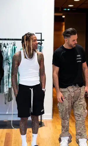 Lil Durk wearing Amiri shorts
