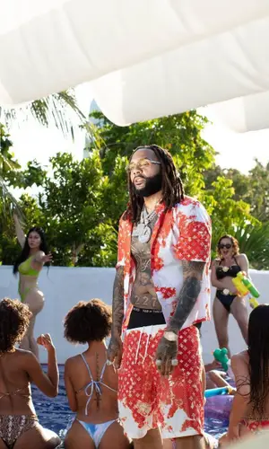 Money Man wearing Louis Vuitton shirt