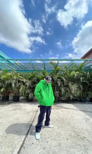 Feid’s Outfit in Bottega Veneta Jacket, Oakley Eyewear & Chrome Hearts Cap (2022)