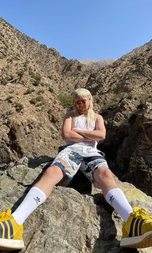 Oliver Tree wearing Adidas sock