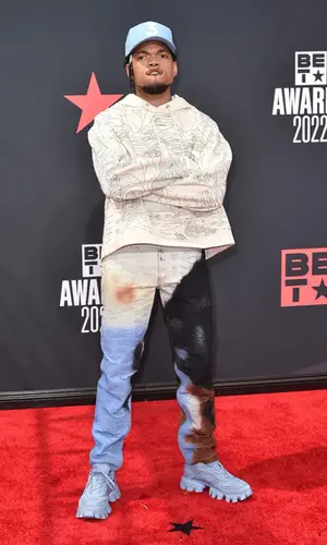 Chance The Rapper wearing Prada sneakers