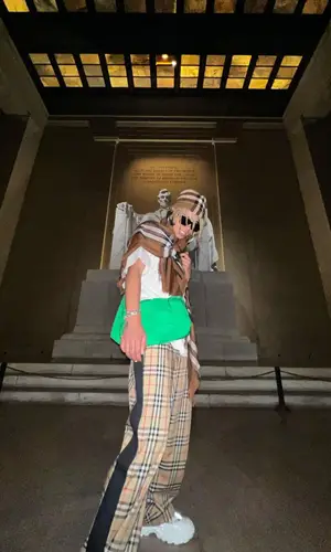 Iann Dior wearing Burberry pants