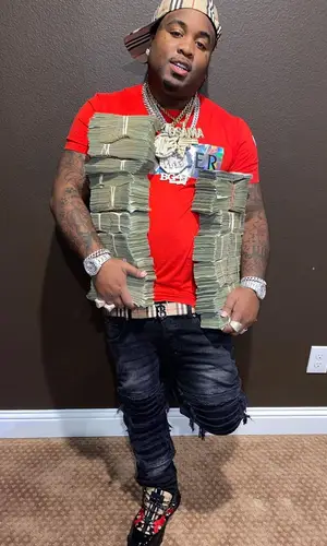 MO3 wearing Burberry cap