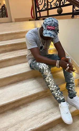 Shawny Binladen wearing Supreme t-shirt