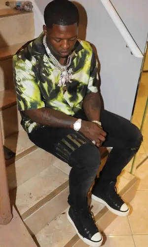 Lil Zay Osama wearing Amiri shirt