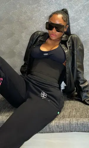 Karlae wearing Off-White top