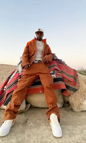 Bloody Osiris wearing Supreme cap