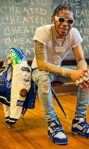 Lil Migo wearing Prada eyewear