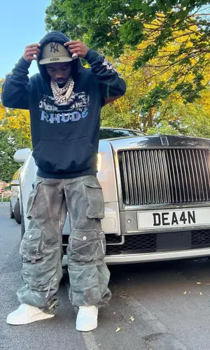 Roddy Ricch’s Outfit in Rhude Hoodie, The Attico Jeans & New Era Cap (2022)