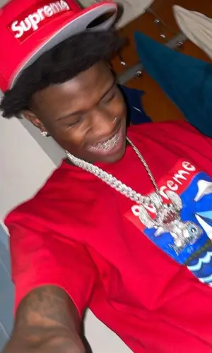 Quando Rondo wearing Supreme cap
