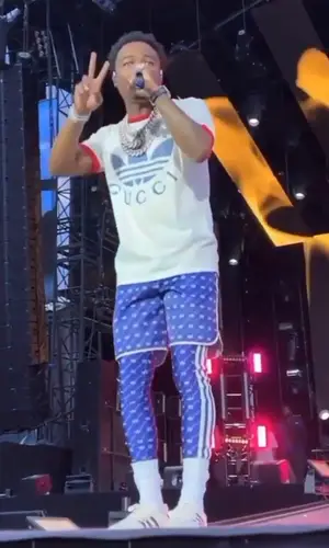 Roddy Ricch wearing Gucci shorts