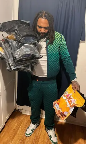 Money Man wearing Louis Vuitton pants