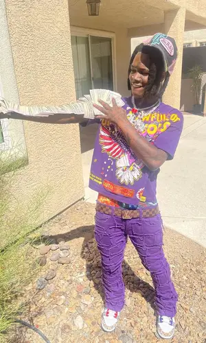 2KBABY’s Outfit in Awful Lot of Cough Syrup T-Shirt, Louis Vuitton Belt & Von Dutch Cap (2022)