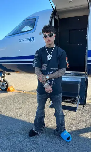 Tony Effe wearing Balenciaga pants