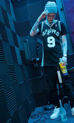 Slim Jesus wearing Mitchell & Ness jersey