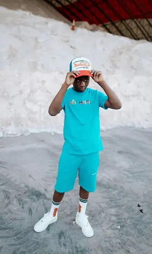 Bouba Savage’s Outfit in Off-White T-Shirt, Nike Sneakers & Sicko Cap (2022)