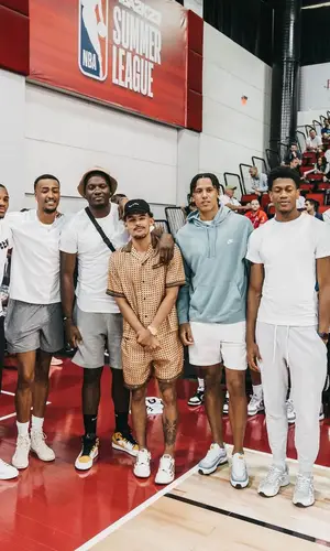 Trae Young wearing Amiri shorts