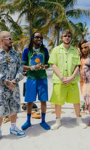J Balvin wearing Louis Vuitton shorts