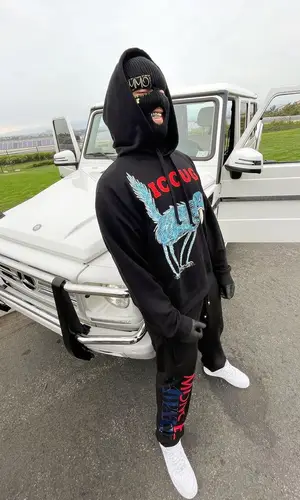 Lil Toe wearing Moncler pants