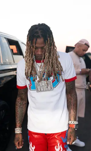 Lil Durk’s Outfit in Louis Vuitton T-Shirt, RoyGBiv Pants & Nike Sneakers (2022)