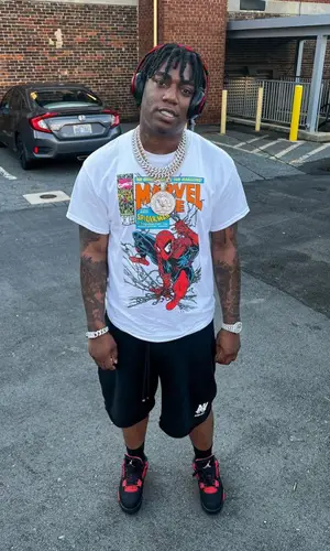 Fredo Bang wearing Amiri shorts