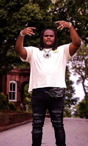 Tee Grizzley wearing Gallery Dept. t-shirt