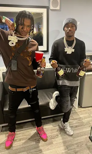 DigDat wearing Louis Vuitton sweatshirt