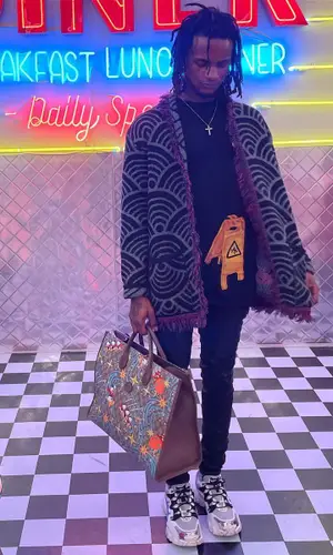 BigBabyGucci wearing Family First jacket