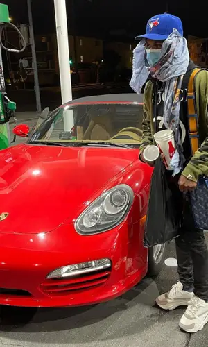 BigBabyGucci wearing Coach bag