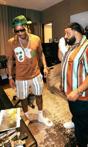 DJ Khaled wearing Prada trousers
