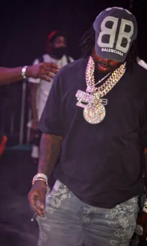 EST Gee wearing Balenciaga cap