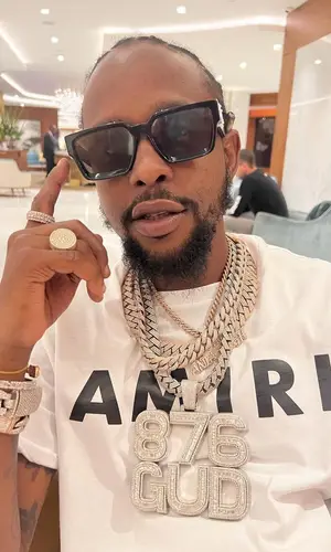 Popcaan’s Outfit in Amiri Jeans & Louis Vuitton Eyewear (2022)