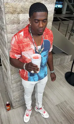 Bankroll Freddie wearing Supreme shirt