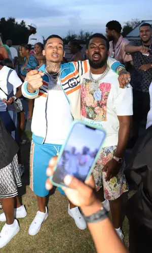 Tion Wayne wearing Louis Vuitton shorts