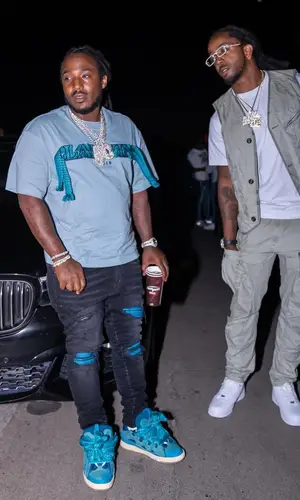 Mozzy wearing Amiri jeans